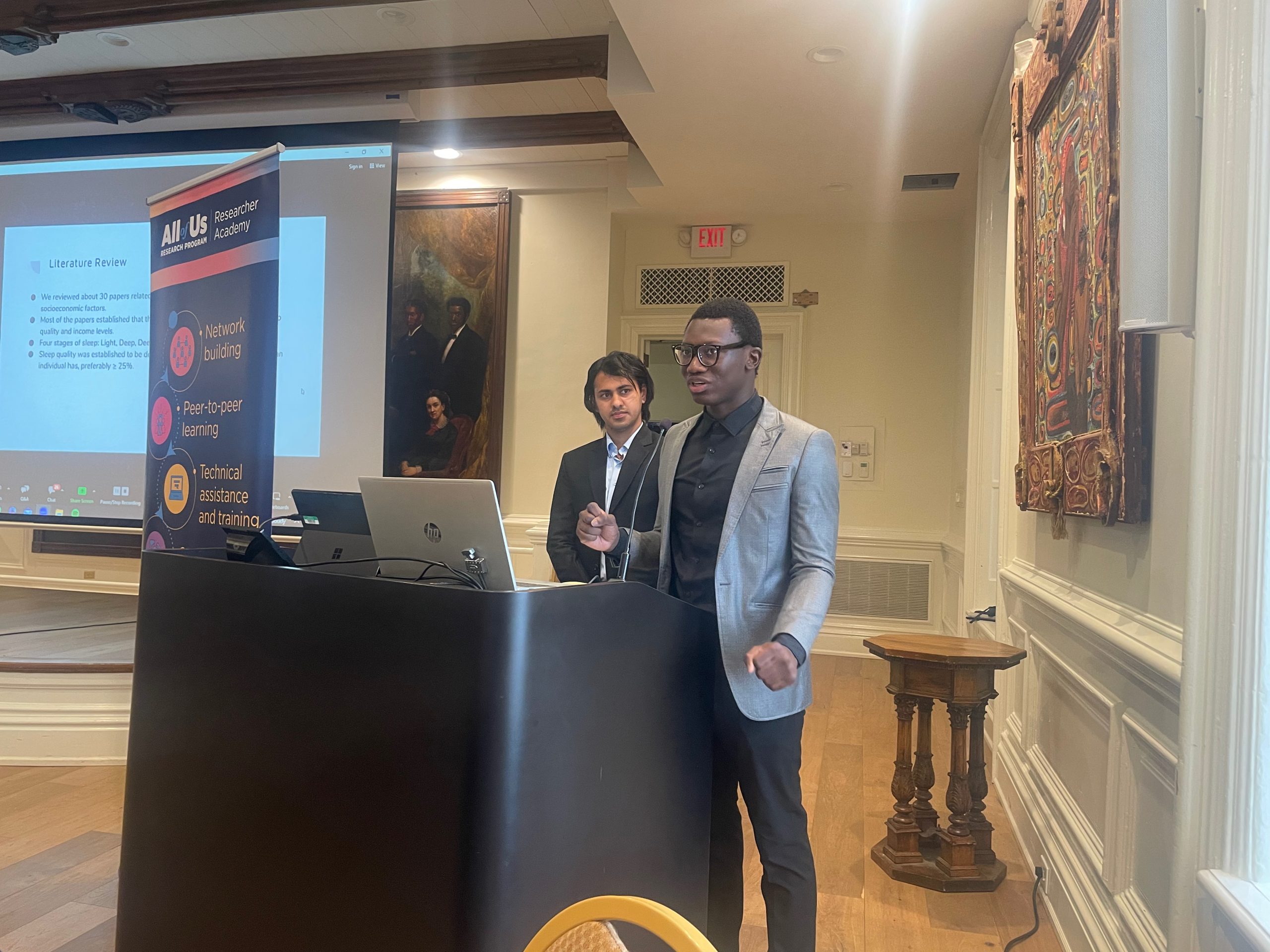 Fisk undergraduate students Oreoluwa Owoseeni and Rejin Nepal present on their research on sleep disparities using the All of Us Workbench. 